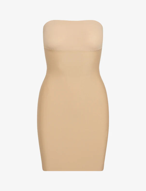 Beige strapless dress on a white background