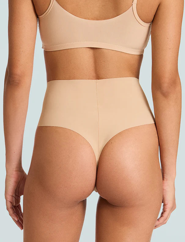 Beige high-waisted underwear on a light blue background