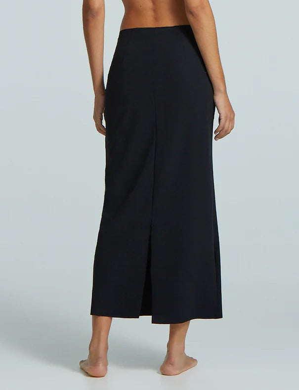 Black wide-leg pants worn by a person on a light gray background