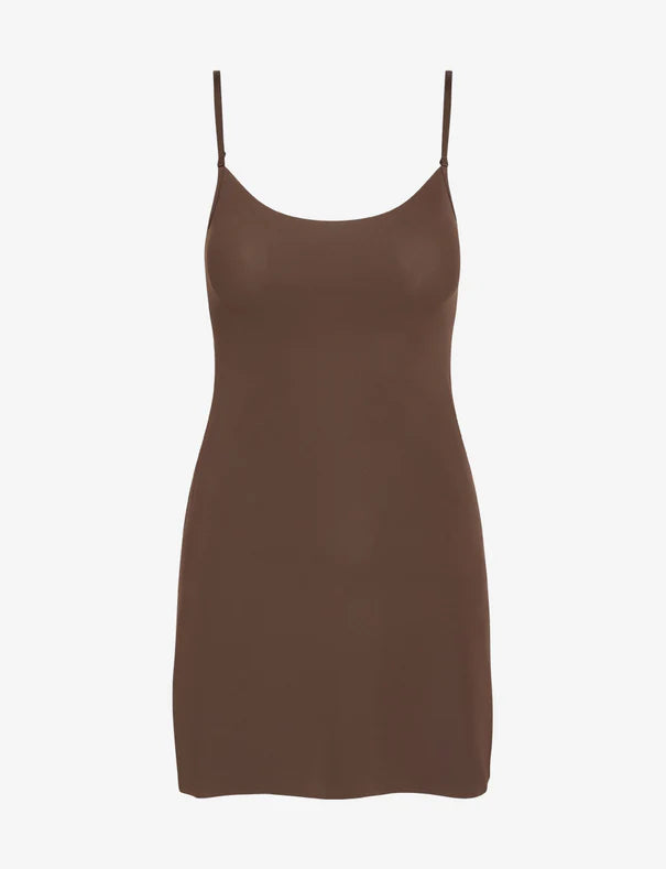 Brown slip dress on a white background
