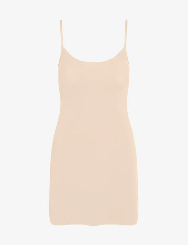 Beige slip dress on a white background