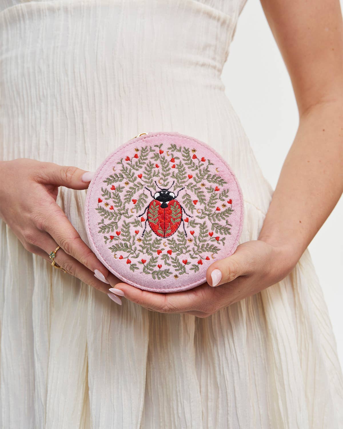 person holding Pink jewelry box with compartments on a white background