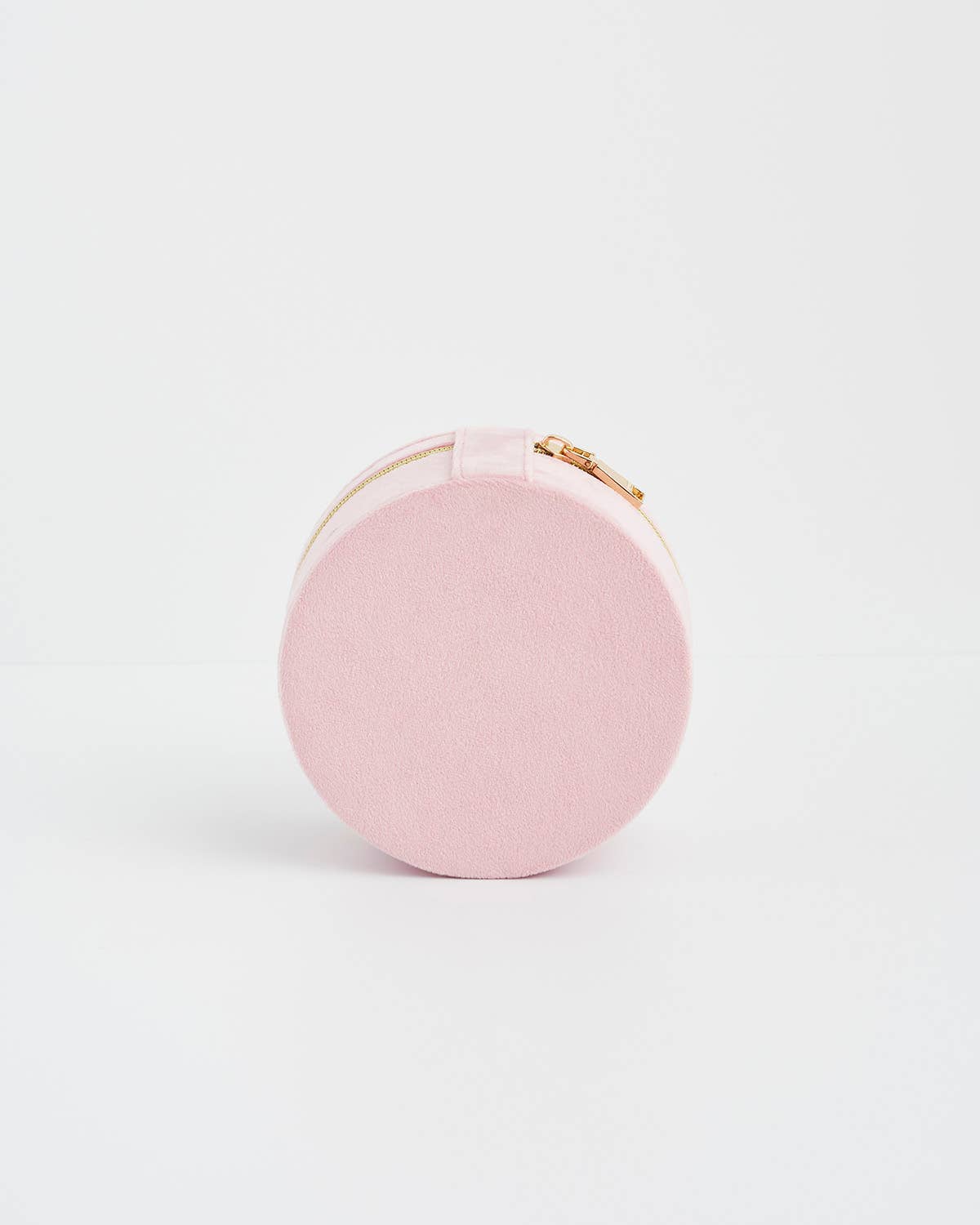 Pink round pouch with gold zipper on a white background