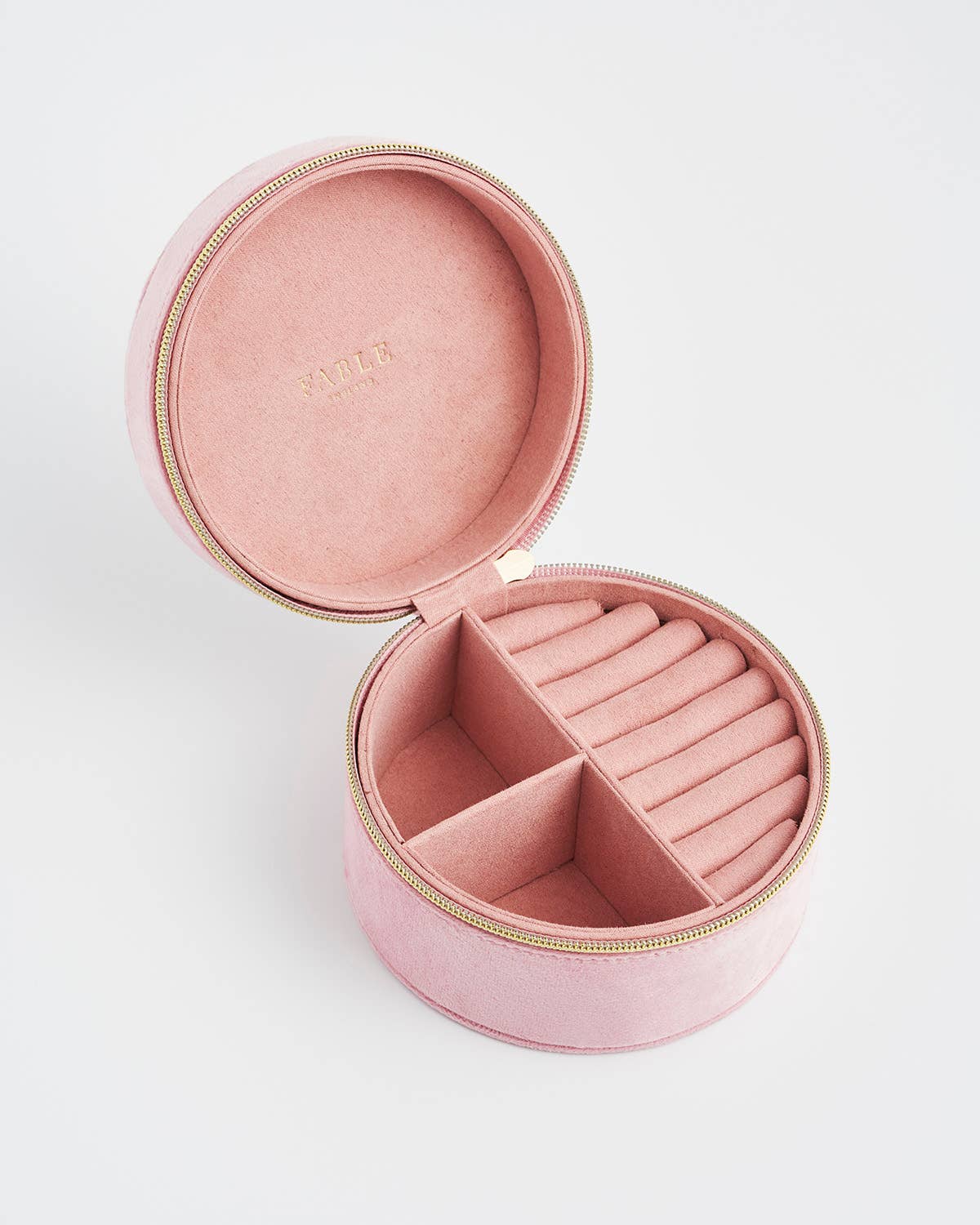 Pink jewelry box with compartments on a white background
