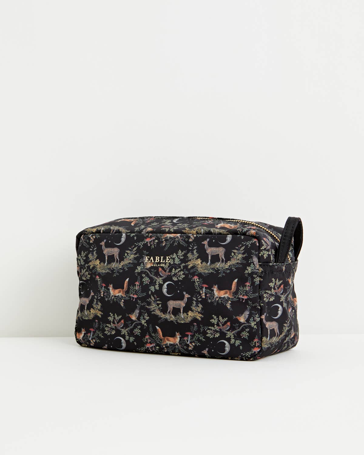 A rectangular zippered pouch by Kable featuring a dark woodland print with deer, foxes, foliage, and crescent moons, shown on a clean white background.