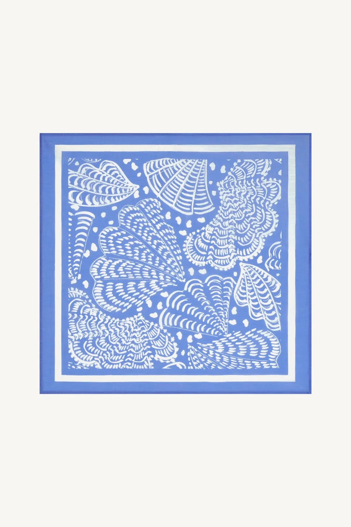 A square scarf featuring a blue and white seashell pattern, displayed flat against a light cream background.