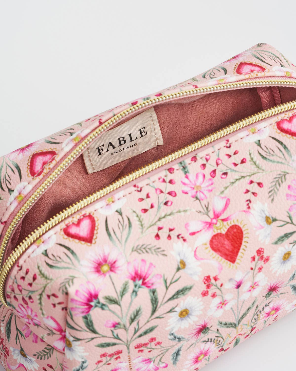 Floral patterned pouch with 'Fable' branding on a white background