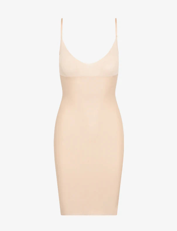 Beige slip dress on a white background