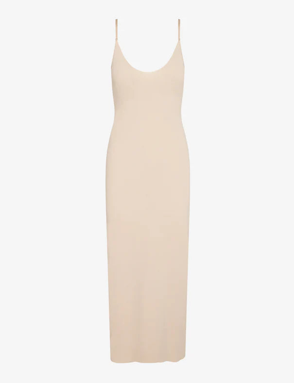 Beige slip dress on a white background