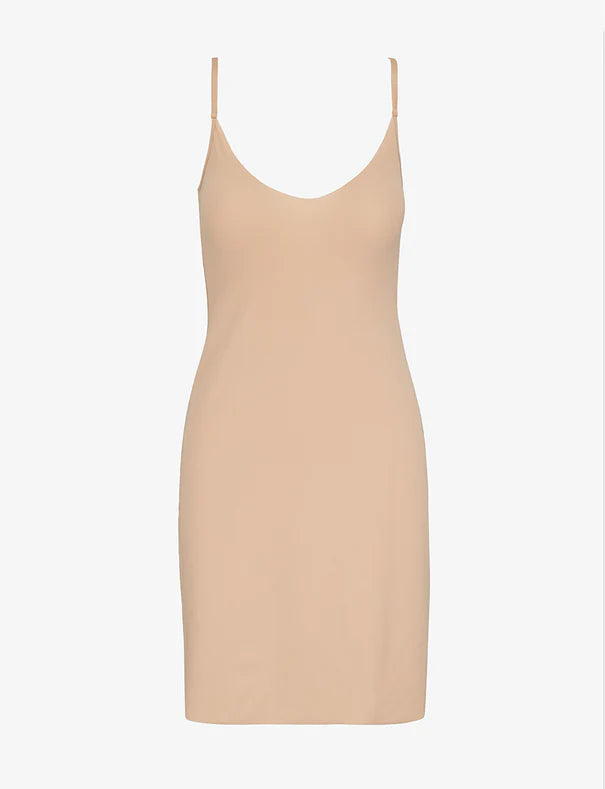Beige slip dress on a white background