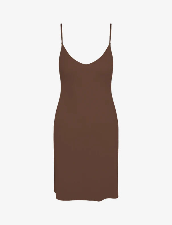 Brown slip dress on a white background