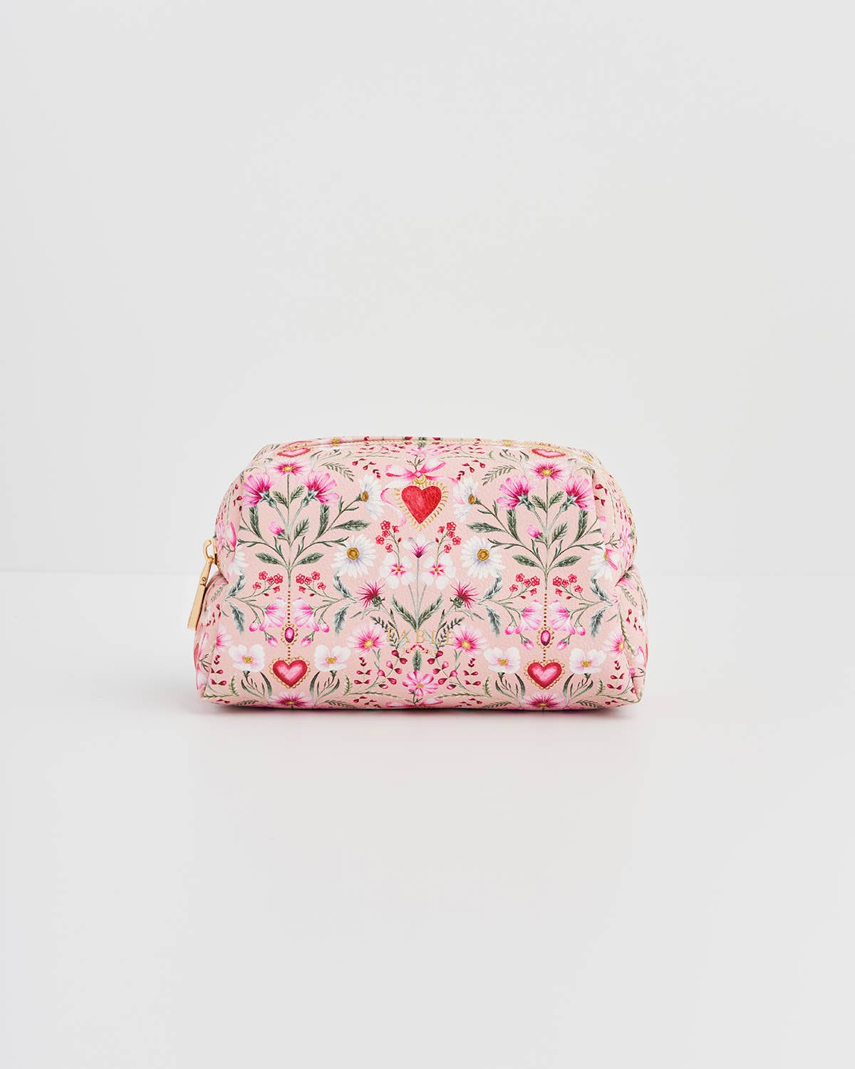 Floral patterned clutch bag with heart designs on a light gray background