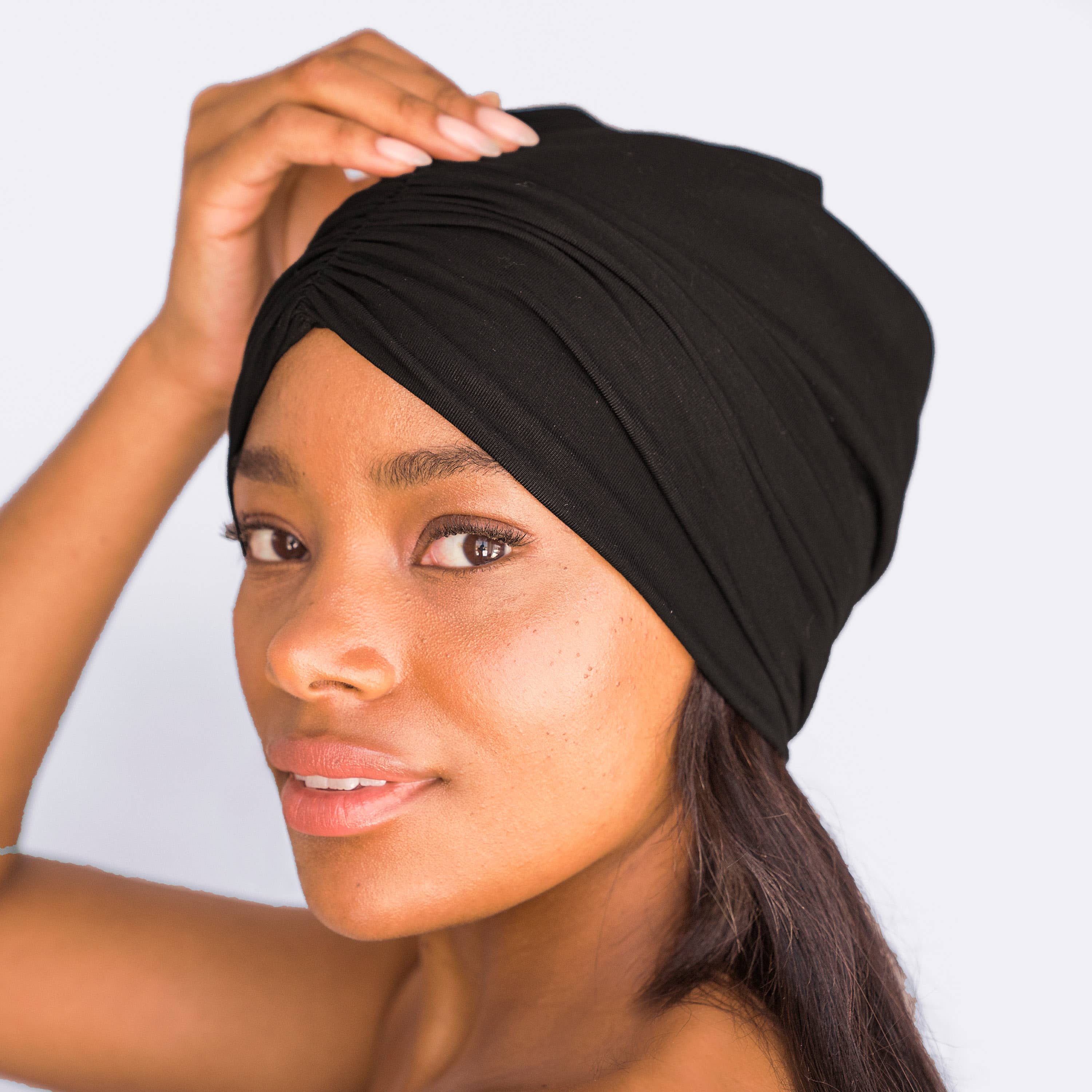 Woman wearing a satin-lined sleep beanie